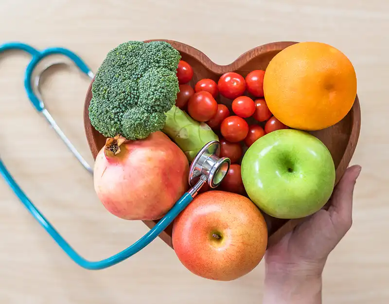 heart shaped bowl of fruit with a stethoscope