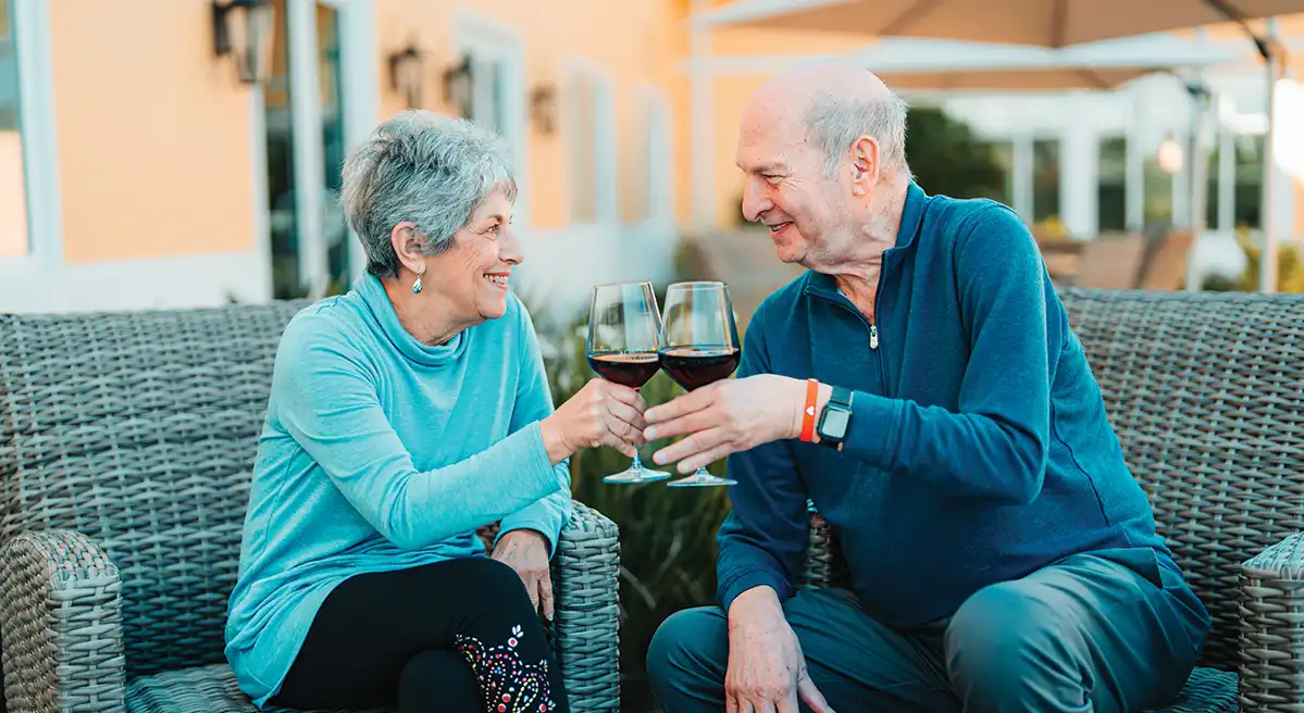 Couple drinking a glass of wine outdoors