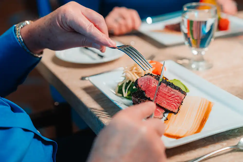 Eating a steak at a restaurant